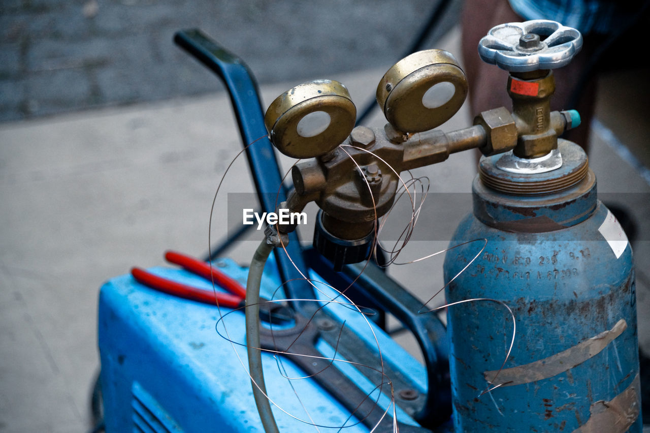 Close-up of gas cylinder in factory