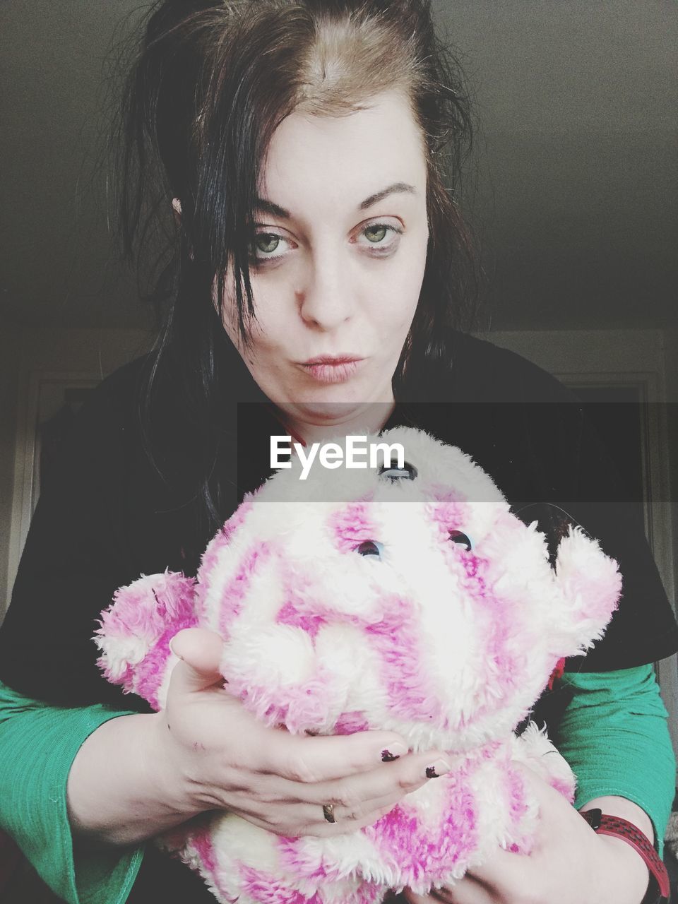 pink, women, one person, portrait, adult, looking at camera, young adult, female, indoors, front view, holding, child, childhood, toy, skin, dress, emotion, hairstyle, stuffed toy, clothing, person, waist up, lifestyles, cute, looking, fashion, home interior