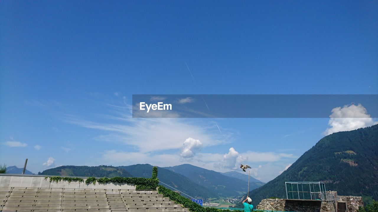 VIEW OF MOUNTAIN RANGE AGAINST CLOUDY SKY