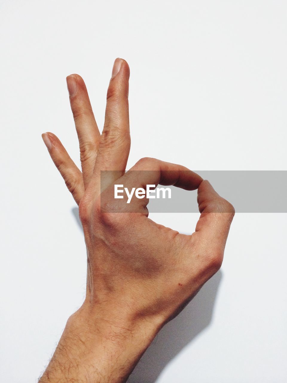 Cropped image of hand making ok sign