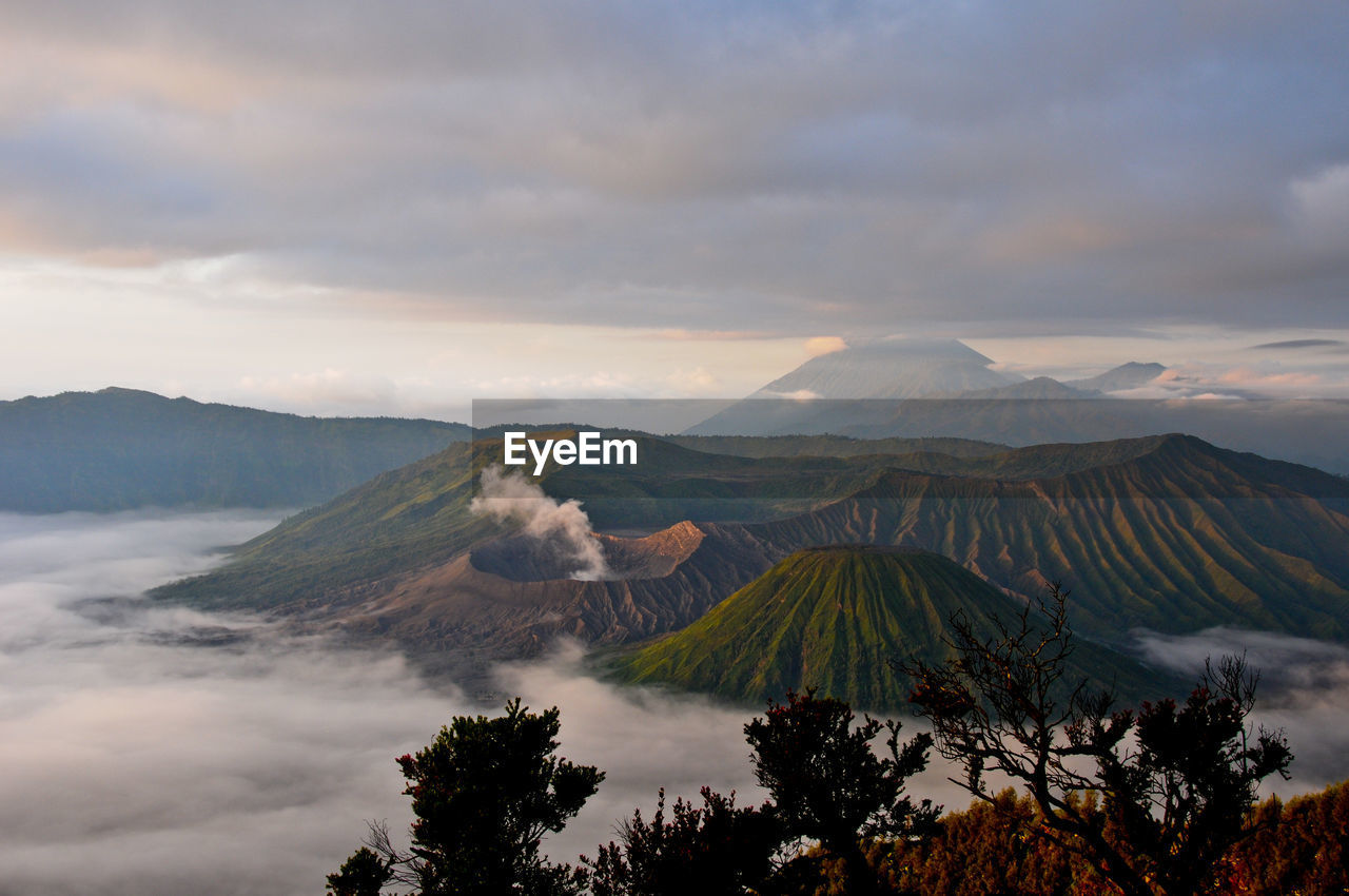 Scenic view of mountains against cloudy sky