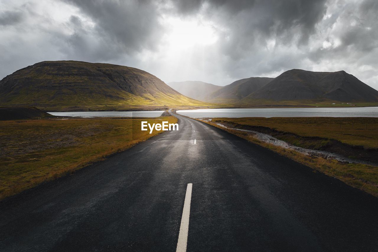 ROAD PASSING THROUGH MOUNTAINS