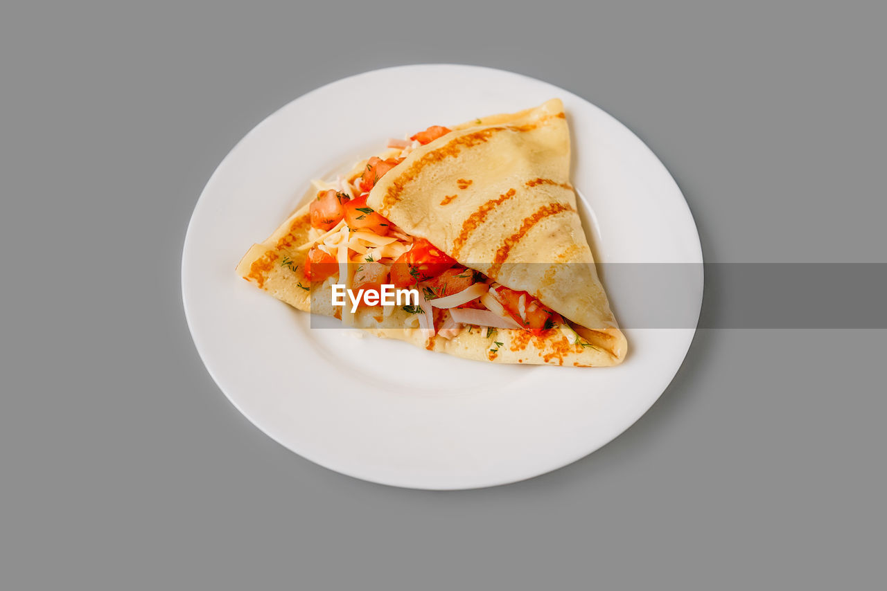 high angle view of food in plate on white background