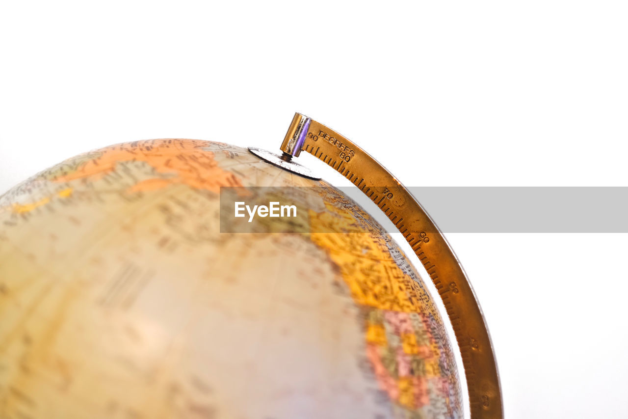 Close-up of globe on white background