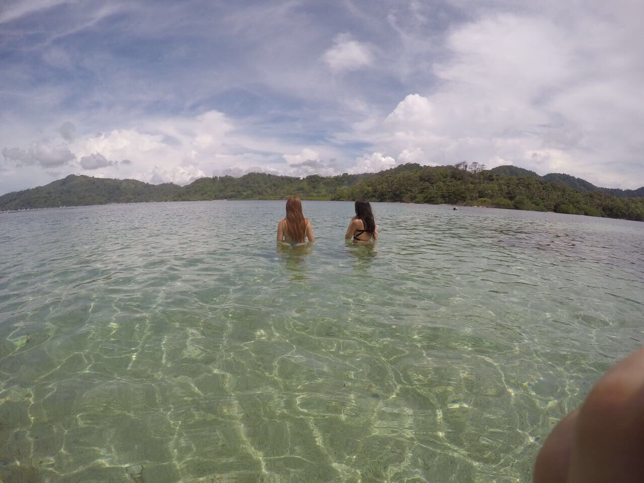 LOW SECTION OF PEOPLE RELAXING IN WATER