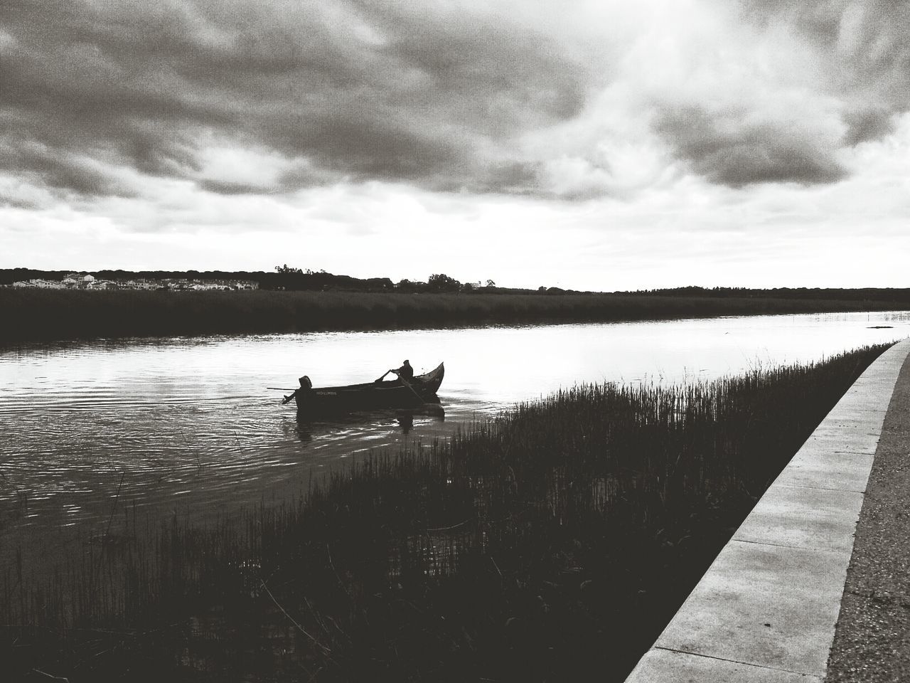 Fishing boat on river at dusk