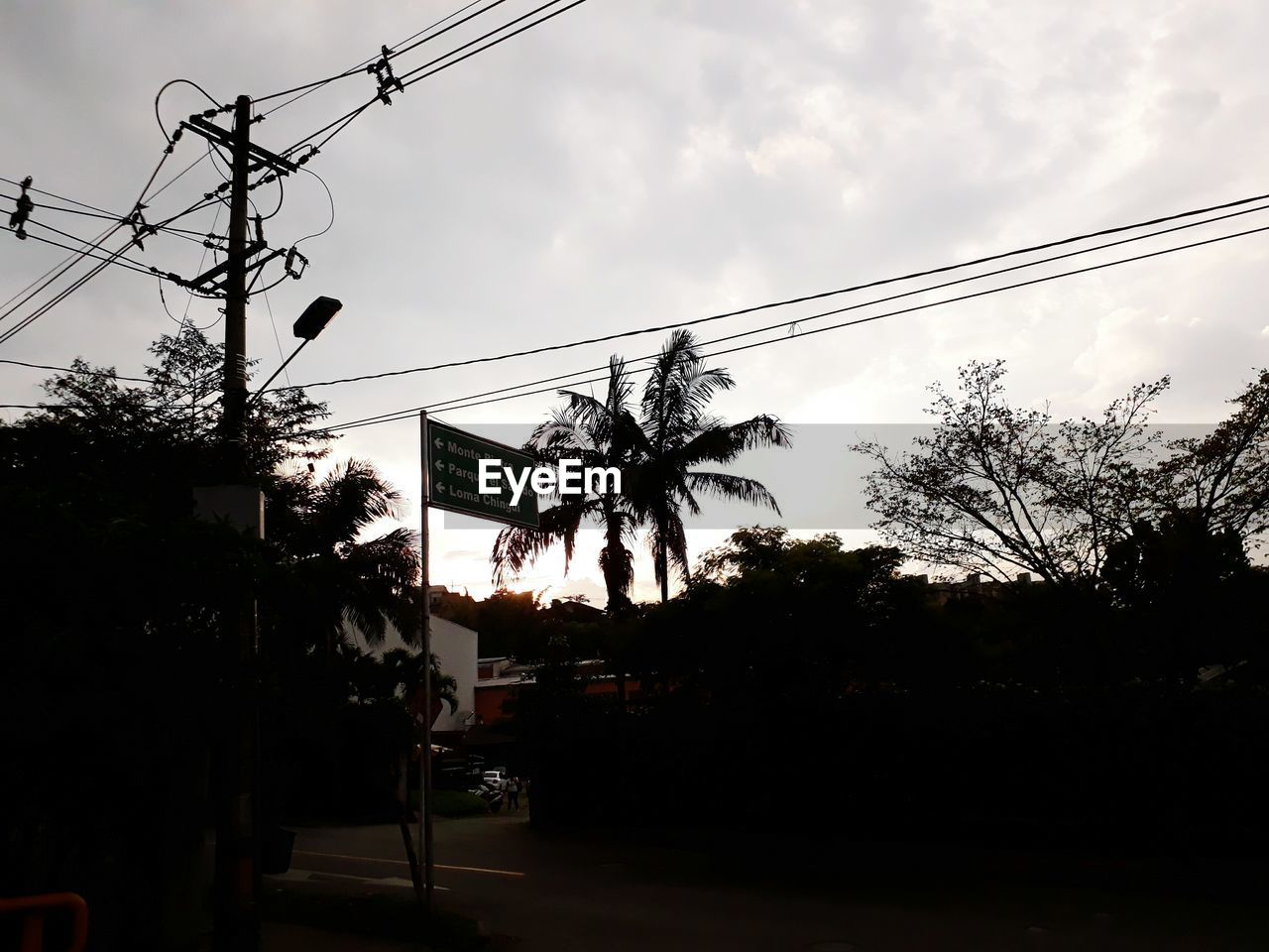 LOW ANGLE VIEW OF ELECTRICITY PYLON IN CITY
