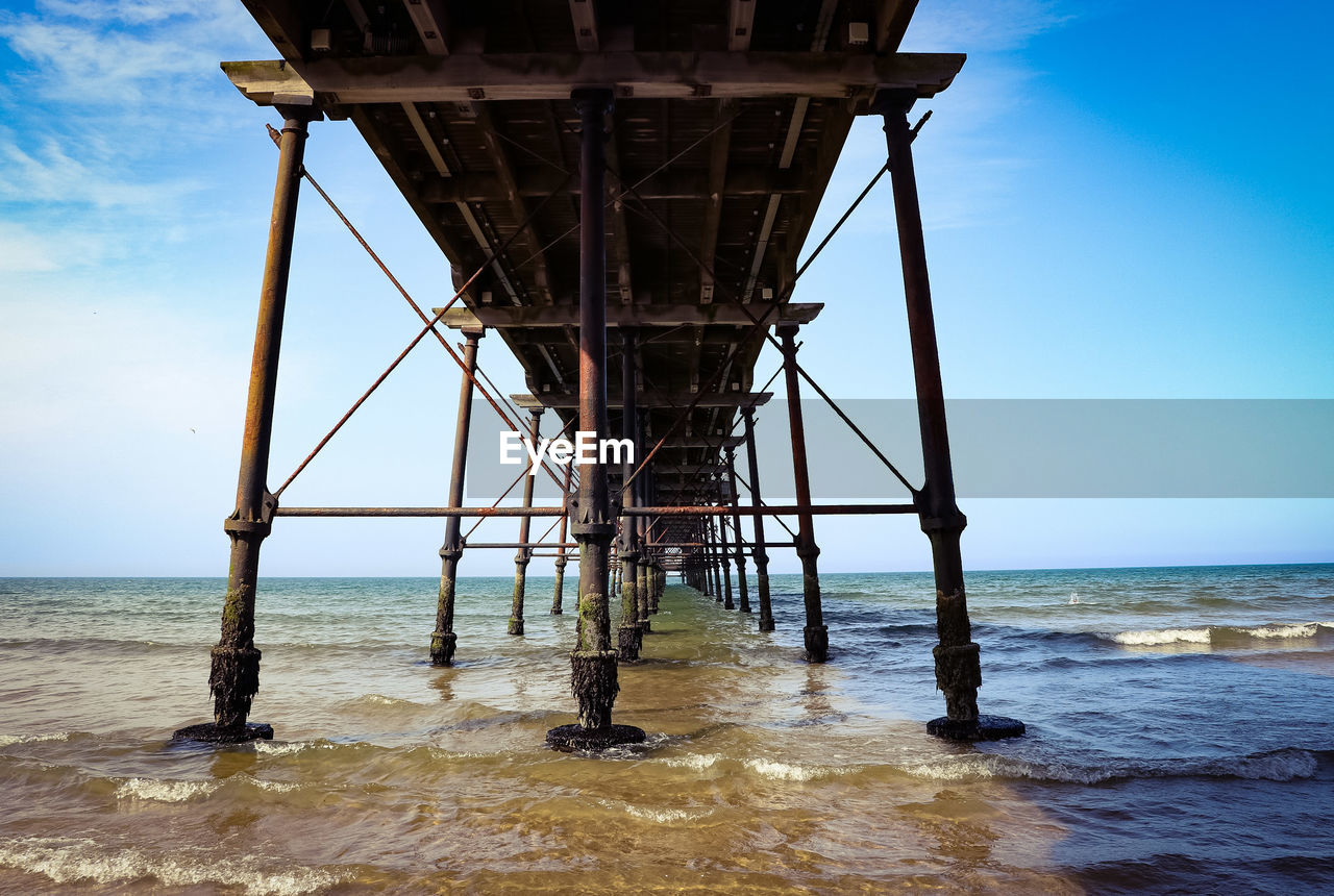 Pier on sea against sky