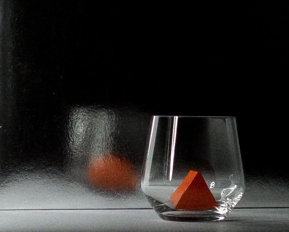 indoors, glass, still life photography, black background, no people, darkness, studio shot, lighting, light, food and drink, still life, close-up, copy space, black, table