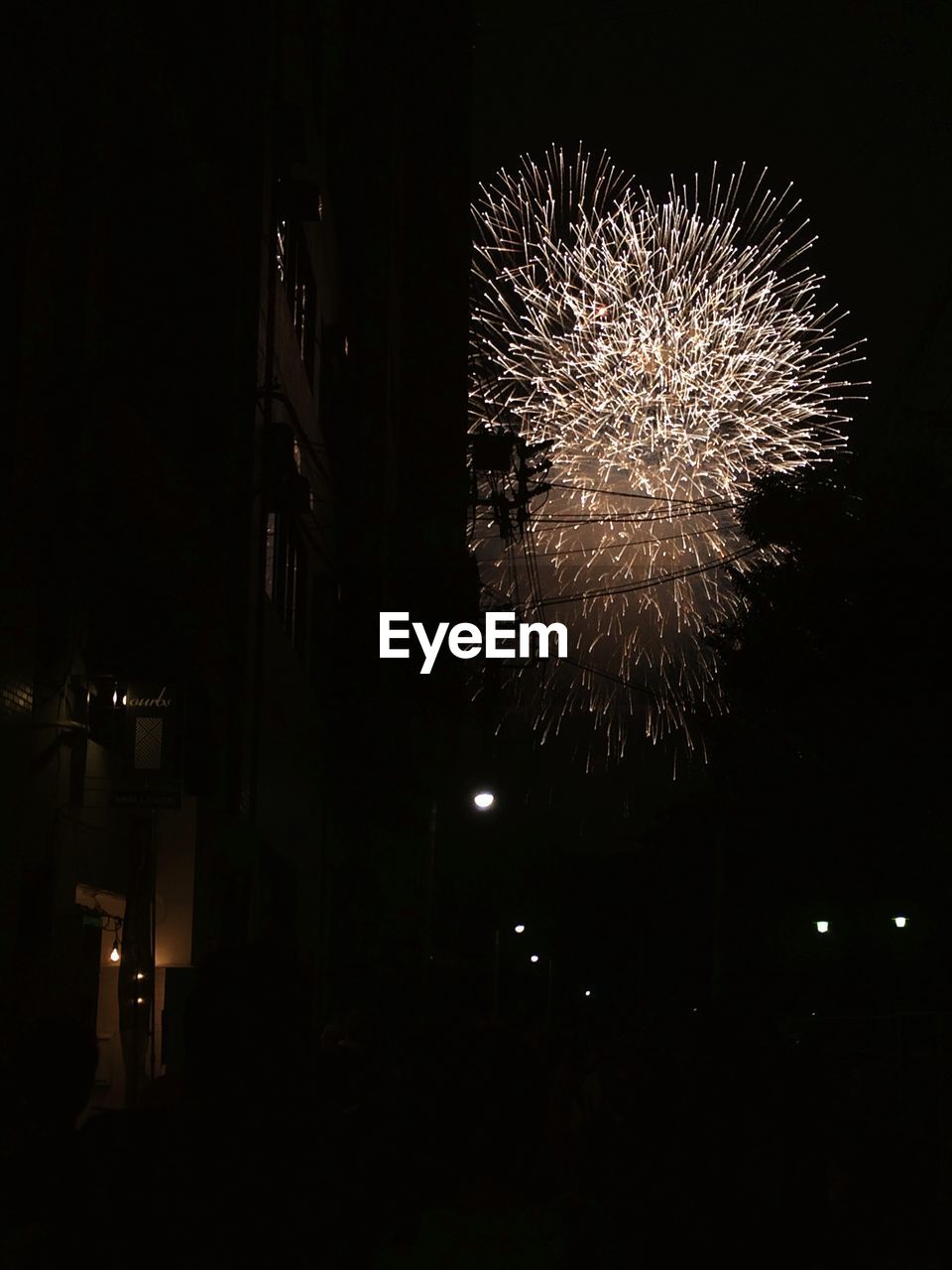 LOW ANGLE VIEW OF FIREWORKS EXPLODING