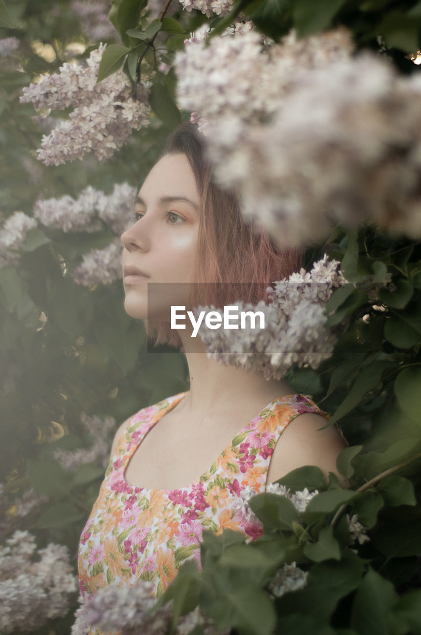 Portrait of young woman looking forward 