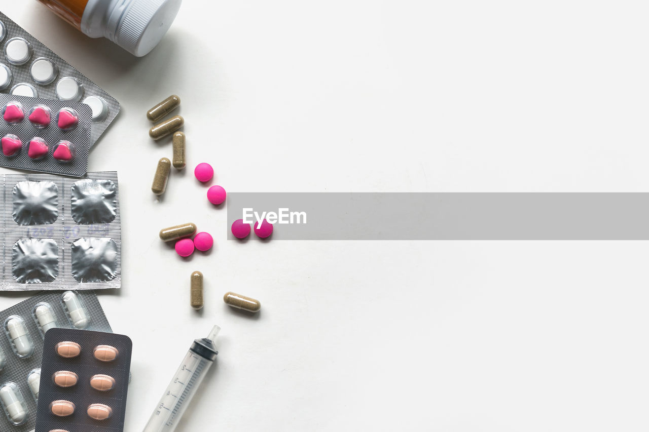 High angle view of medicines on white background