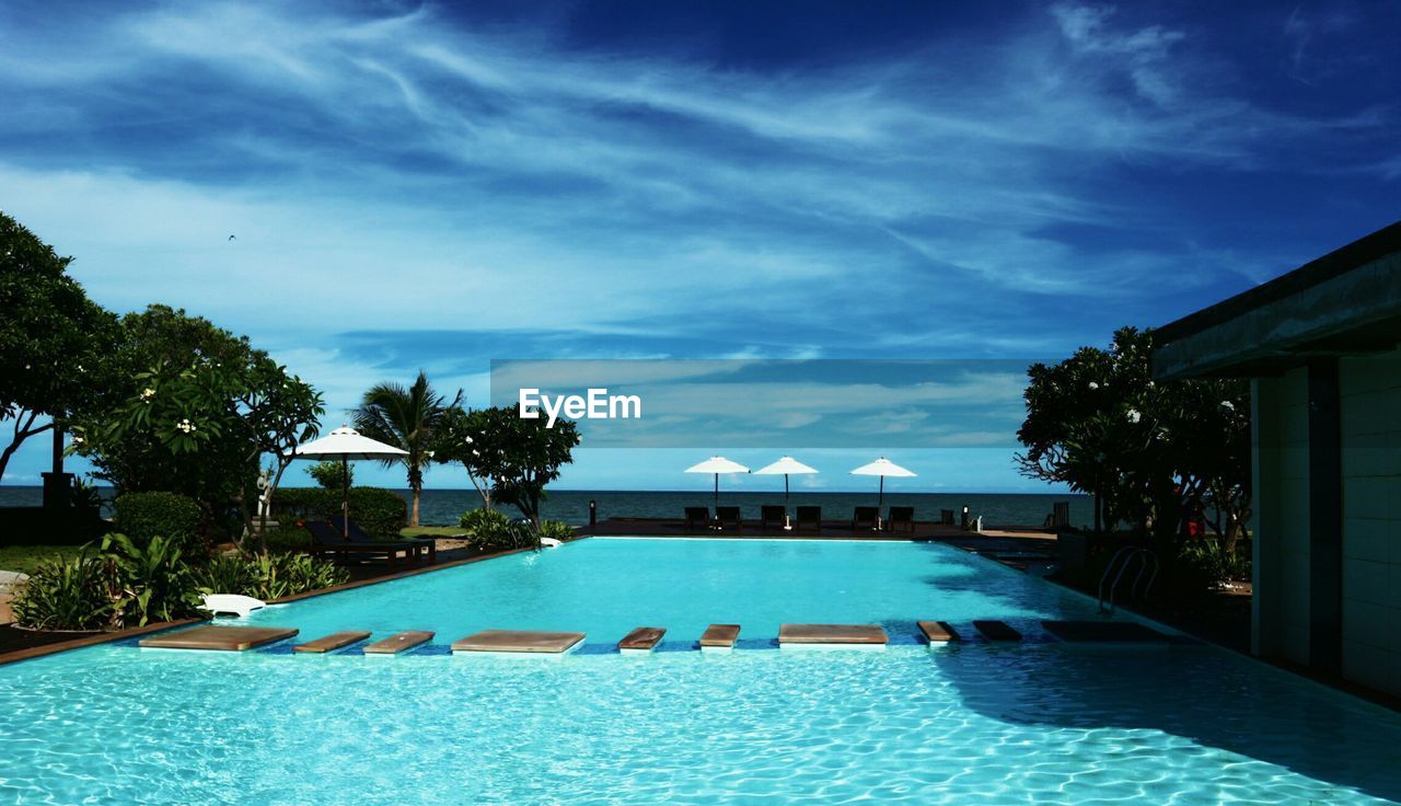 Swimming pool against blue sky