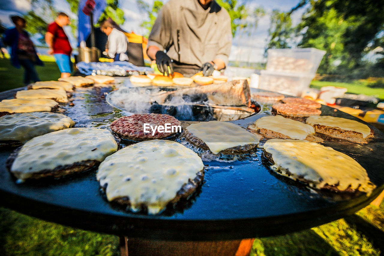 Close-up of burger patty on barbecue grill