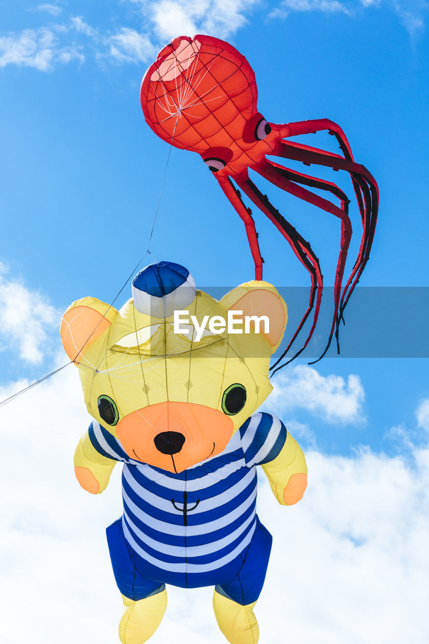 Flying kite with red octopus-shaped and bear animal