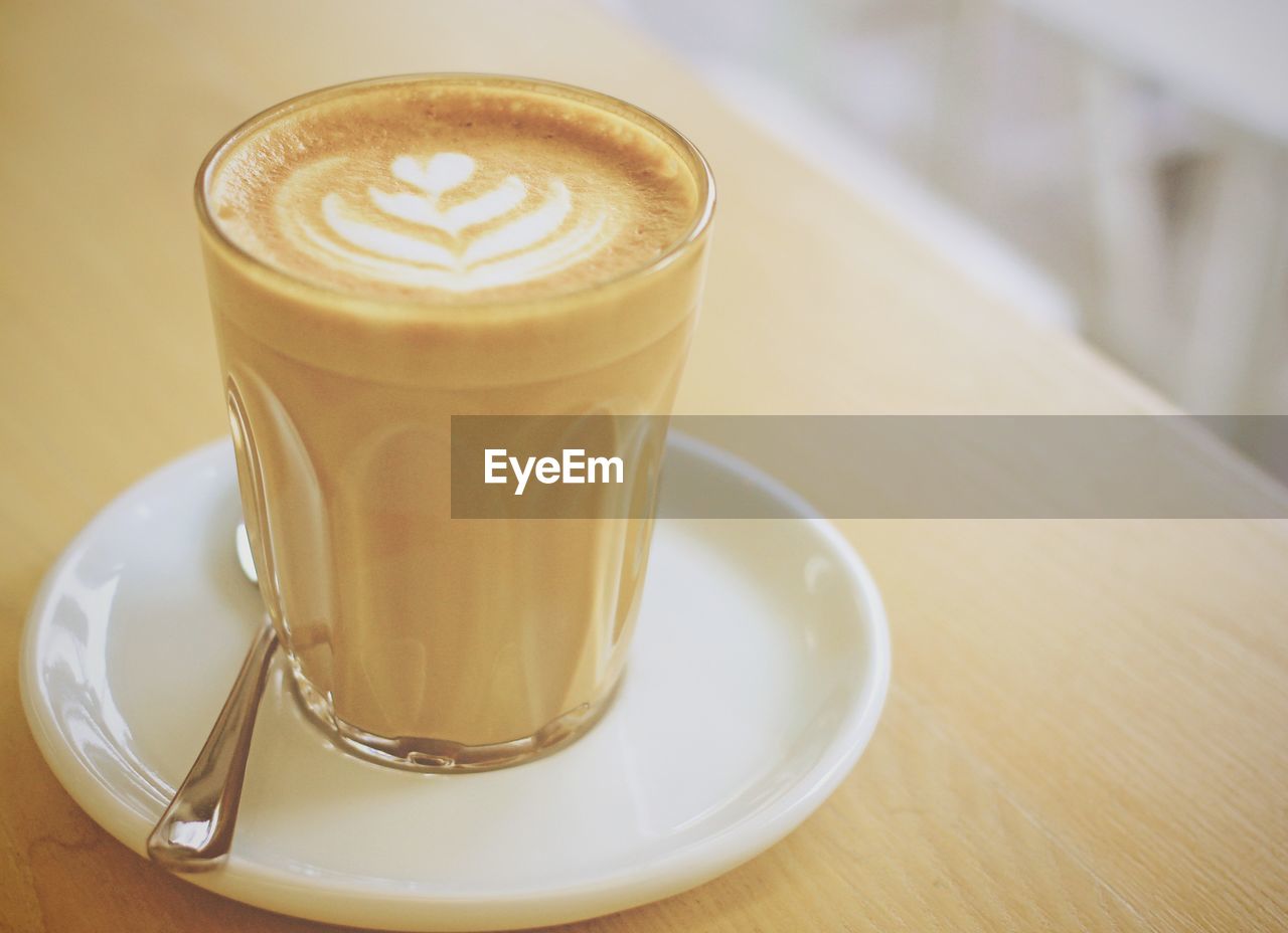 Close-up of cappuccino on table