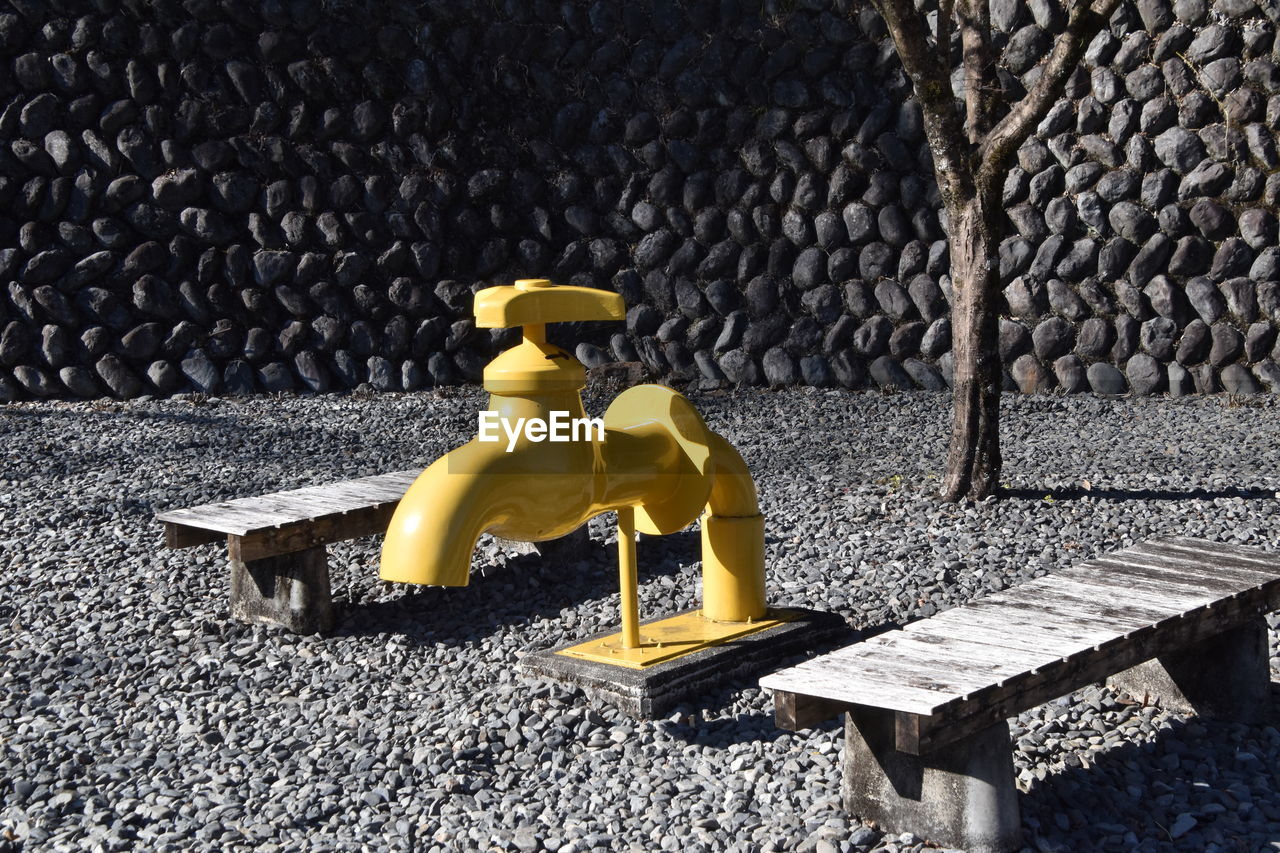 yellow, seat, no people, furniture, representation, toy, sunlight, nature, day, bench, outdoors, human representation, protection