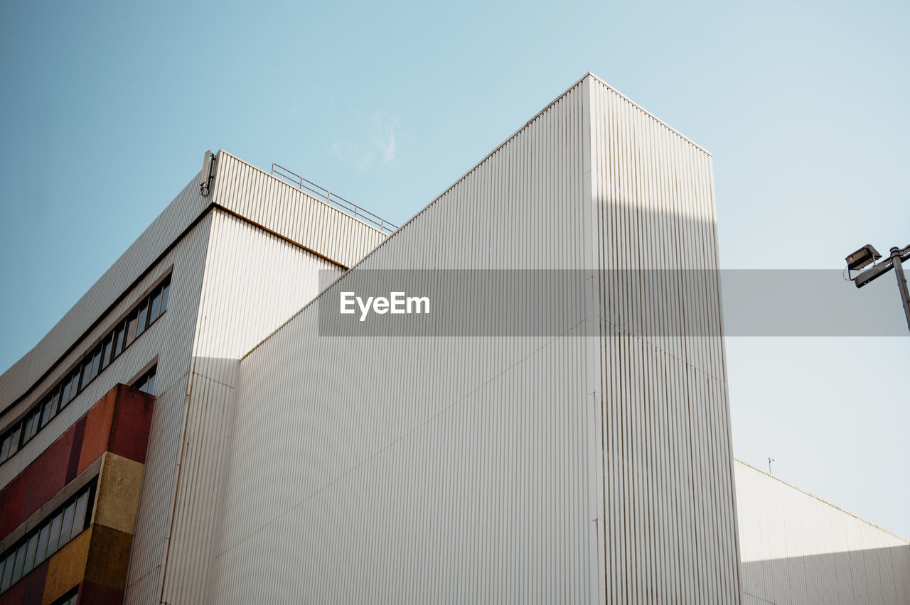 low angle view of building against clear blue sky