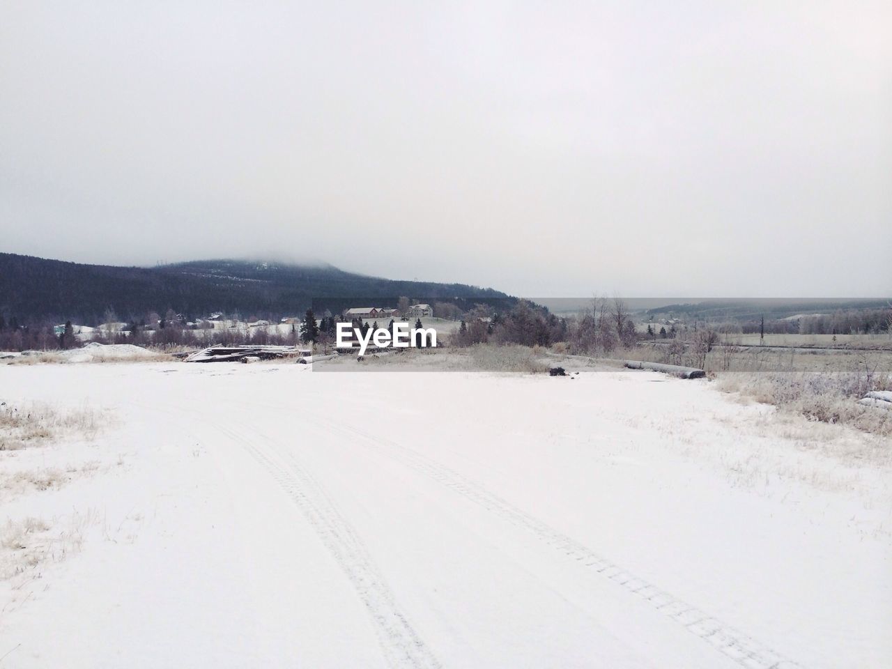View of snow covered landscape against clear sky