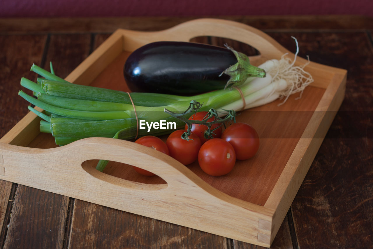 Close-up of vegetables on cutting board over table