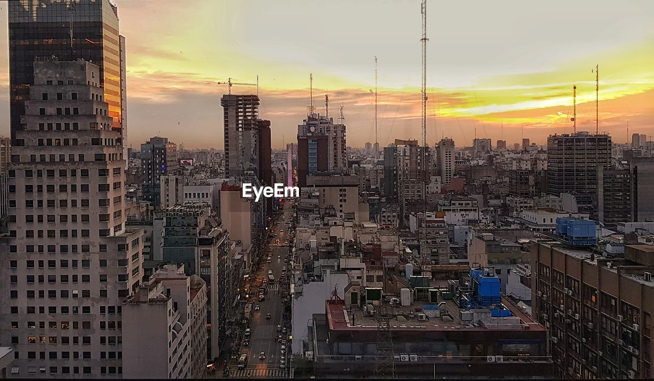 CITYSCAPE AGAINST SKY DURING SUNSET