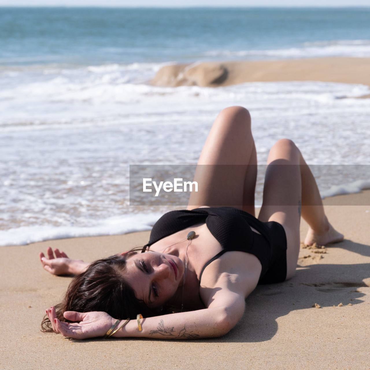 Young woman relaxing at beach