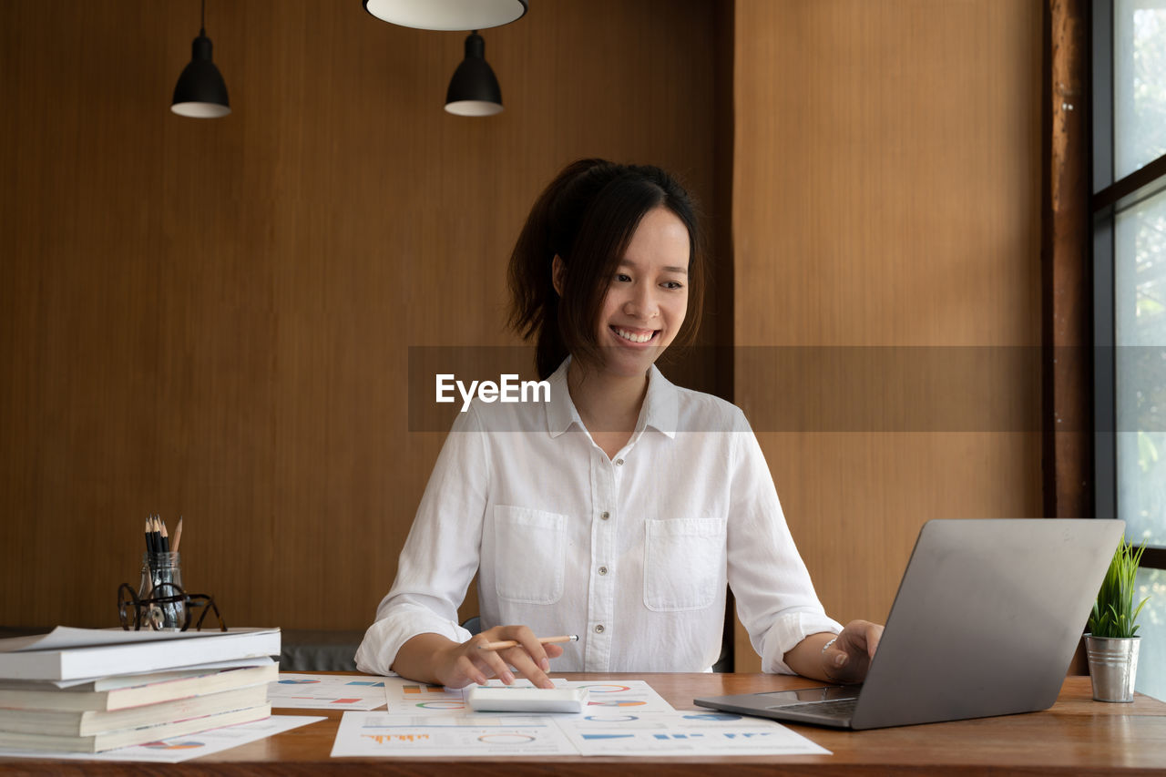 portrait of young businesswoman working at desk