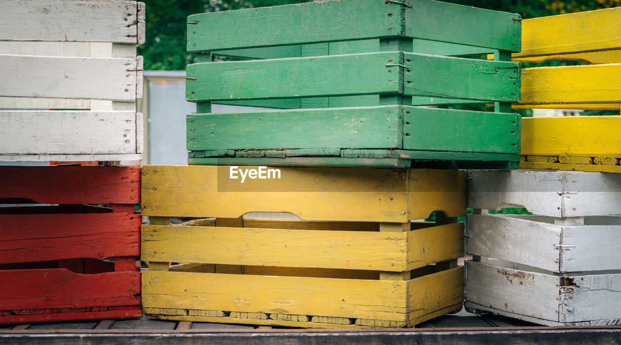 Colorful wooden crates stacked outdoors