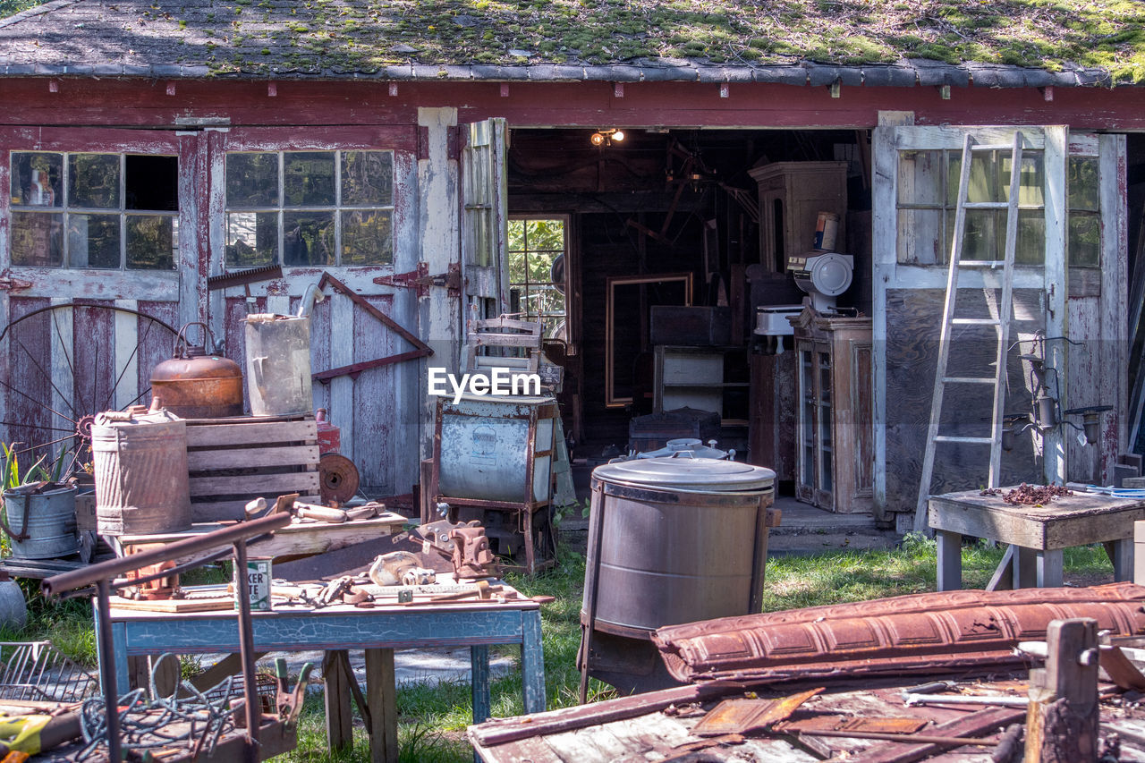 Old rustic barn sale with lots of wood and metal treasures
