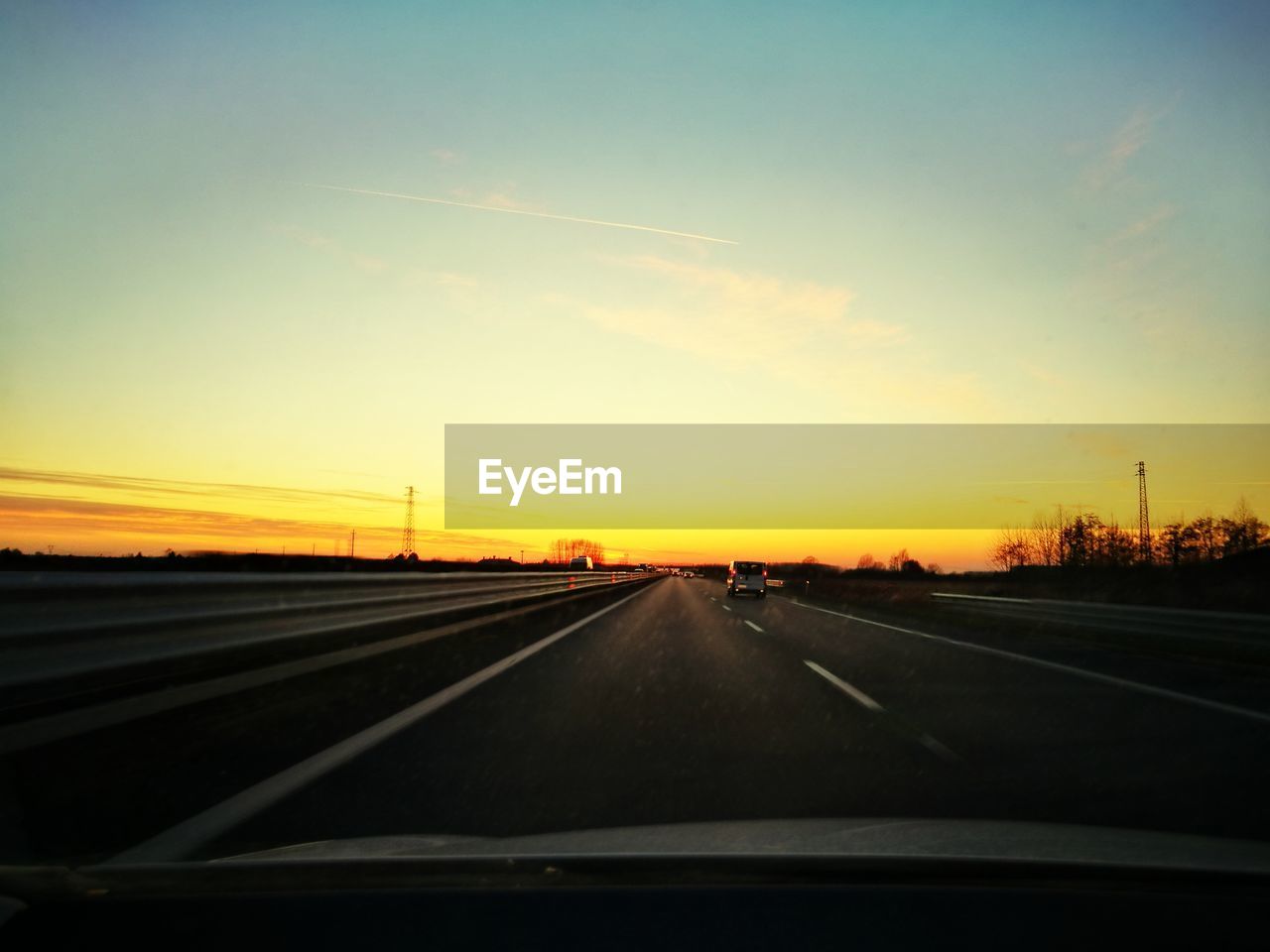 HIGHWAY AGAINST SKY DURING SUNSET