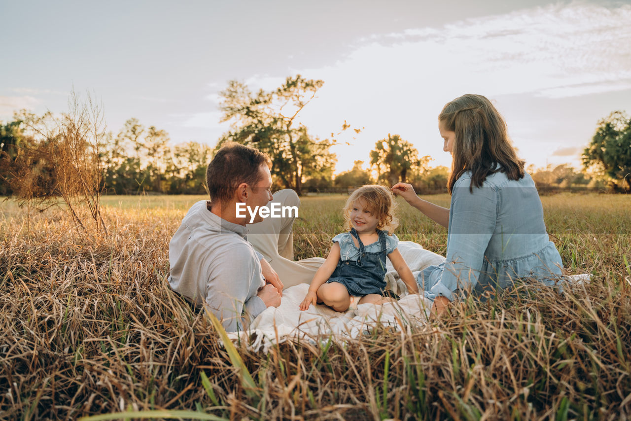 Young couple with cute two-years-old girl