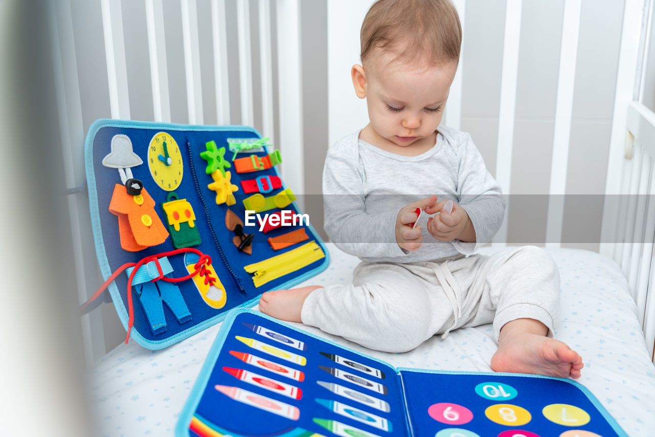 portrait of boy playing with toy blocks