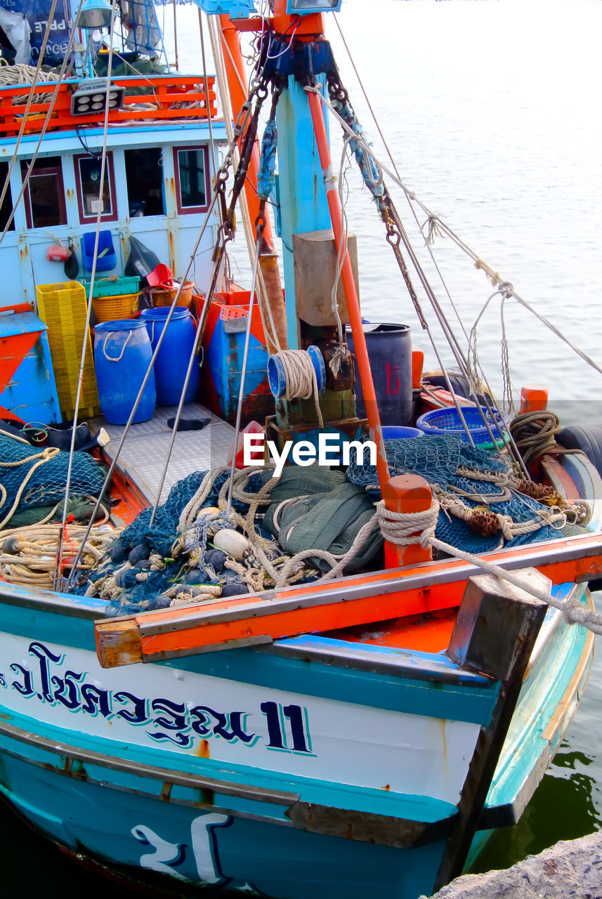 FISHING BOATS MOORED AT HARBOR