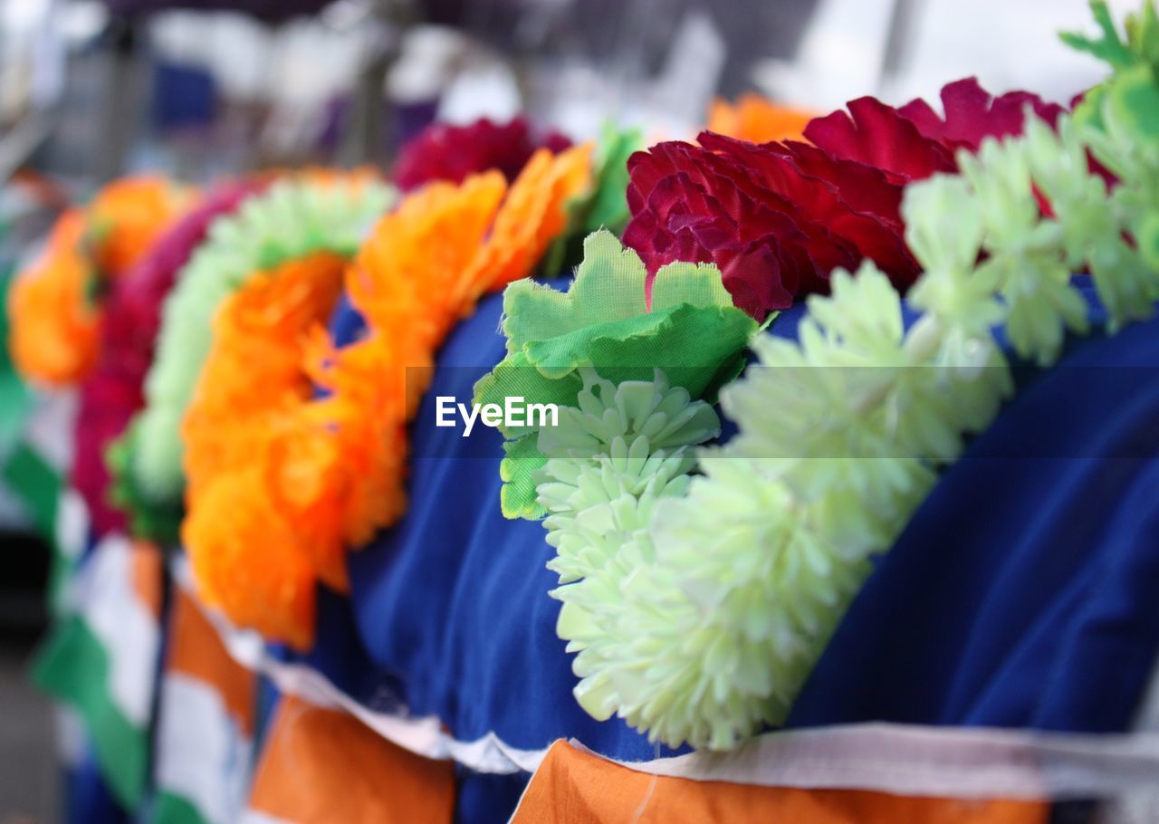 CLOSE-UP OF FLOWERS FOR SALE IN MARKET
