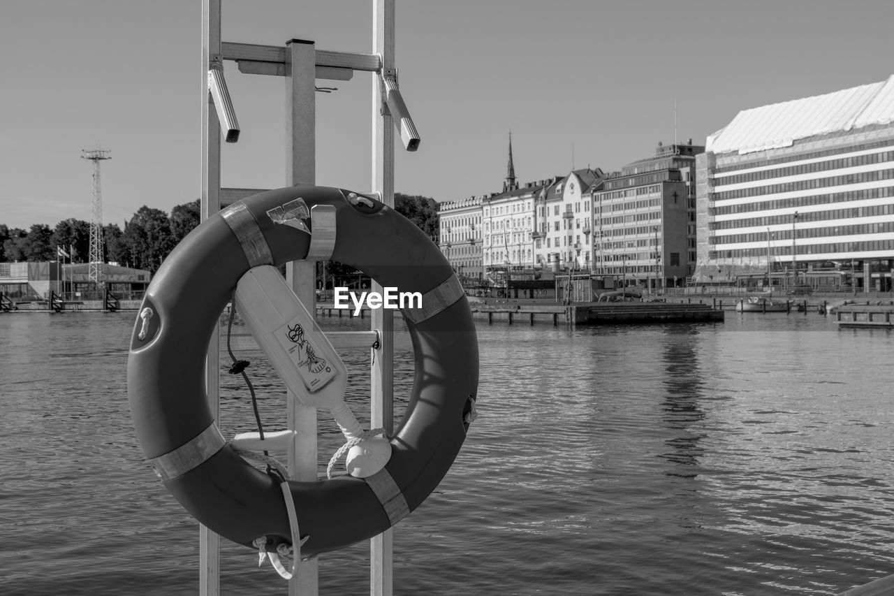 water, black and white, architecture, built structure, monochrome photography, sky, monochrome, building exterior, city, lifebuoy, nature, day, clear sky, vehicle, nautical vessel, transportation, river, ship, waterfront, outdoors, black, no people, travel destinations