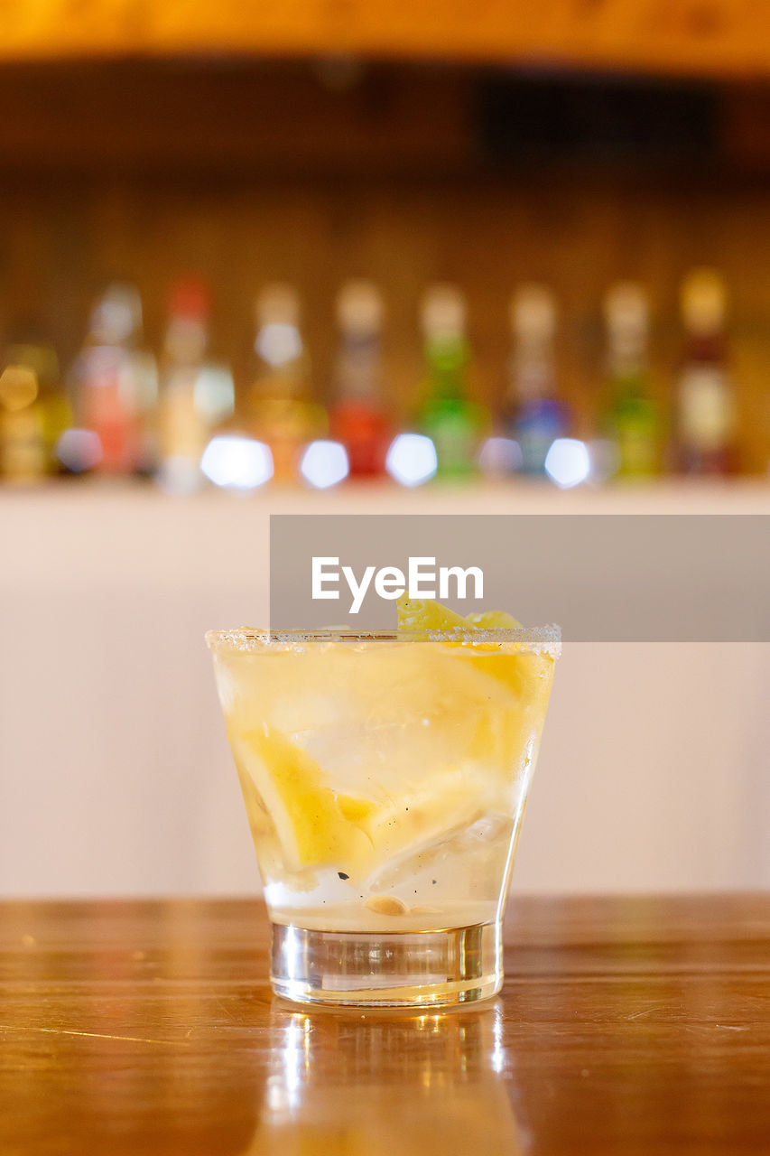 Close-up of cocktail on wooden table