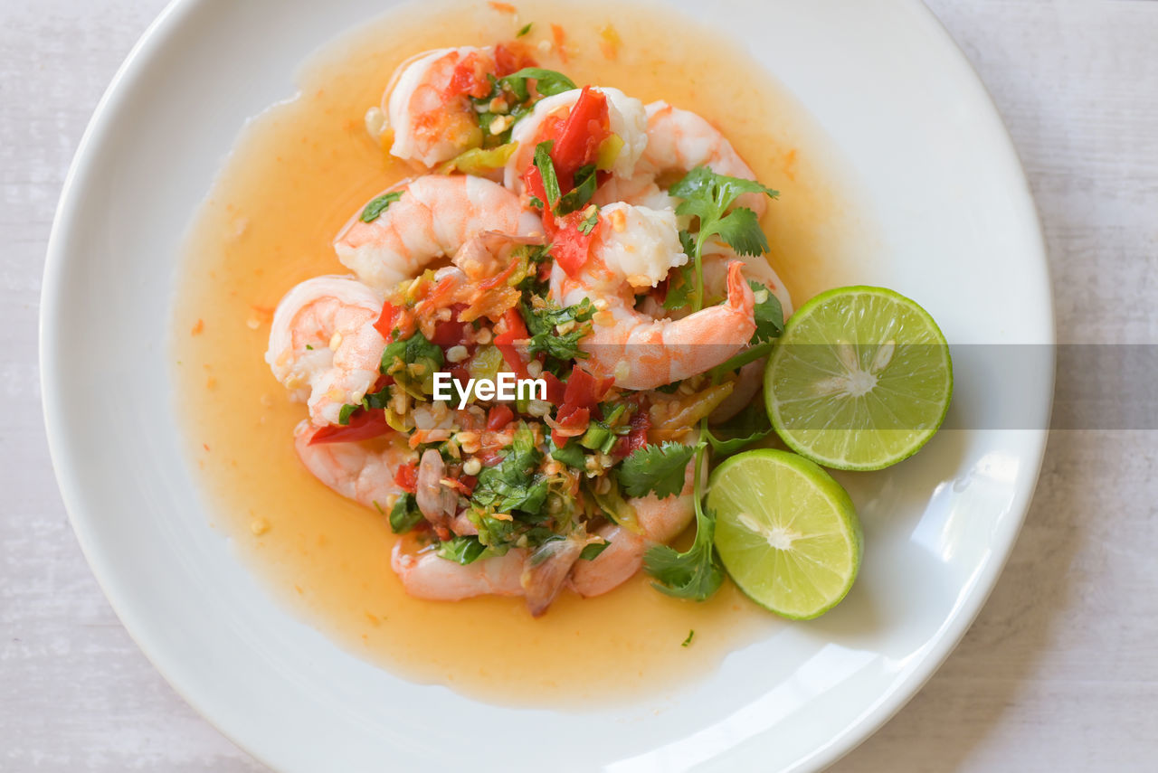 food and drink, food, healthy eating, seafood, dish, fruit, wellbeing, freshness, citrus fruit, fish, scampi, lemon, shrimp, produce, plate, herb, lime, vegetable, no people, slice, cuisine, crustacean, indoors, meal, garnish, prawn, meat, table, close-up, bowl, directly above, restaurant, high angle view, animal, serving size, spice