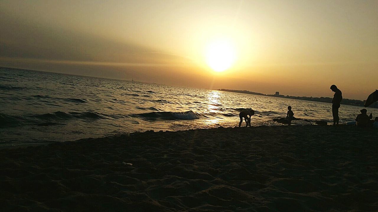 SILHOUETTE OF MAN ON BEACH