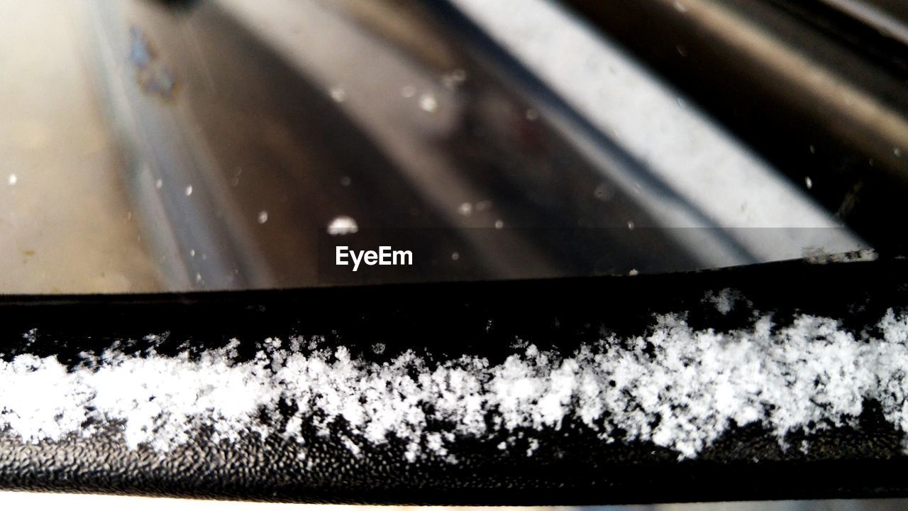 CLOSE-UP OF SNOW AGAINST SKY DURING NIGHT