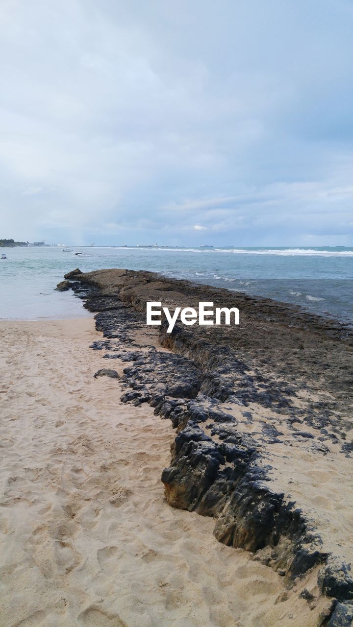 Scenic view of beach against sky