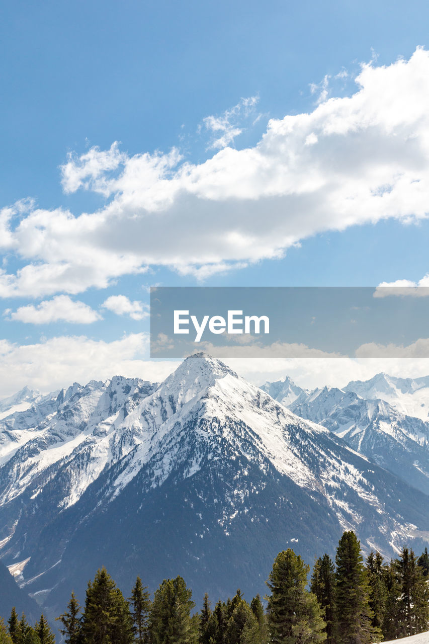 Scenic view of snowcapped mountains against sky