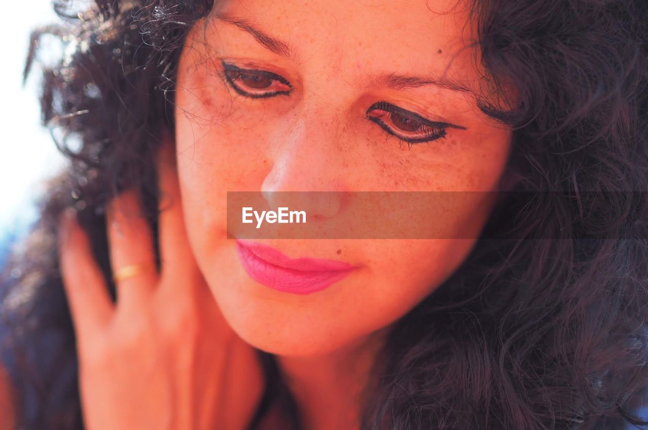 CLOSE-UP PORTRAIT OF A WOMAN