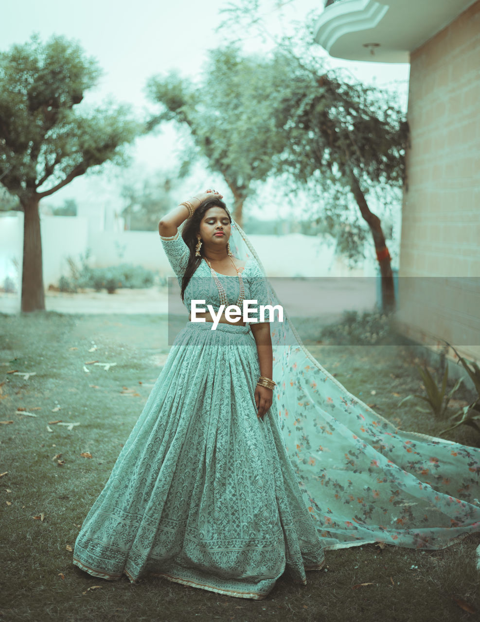 Portrait of young indian woman standing outdoors