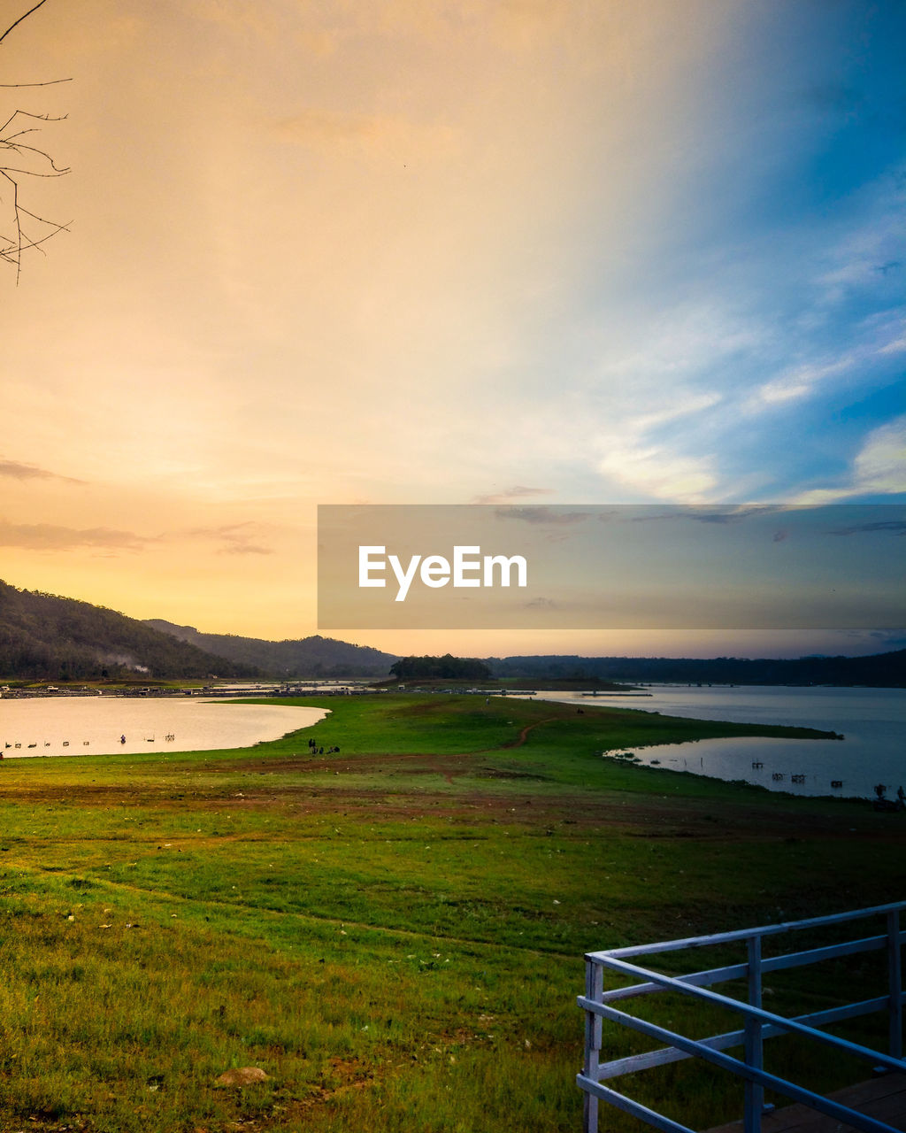 SCENIC VIEW OF LAND AGAINST SKY DURING SUNSET