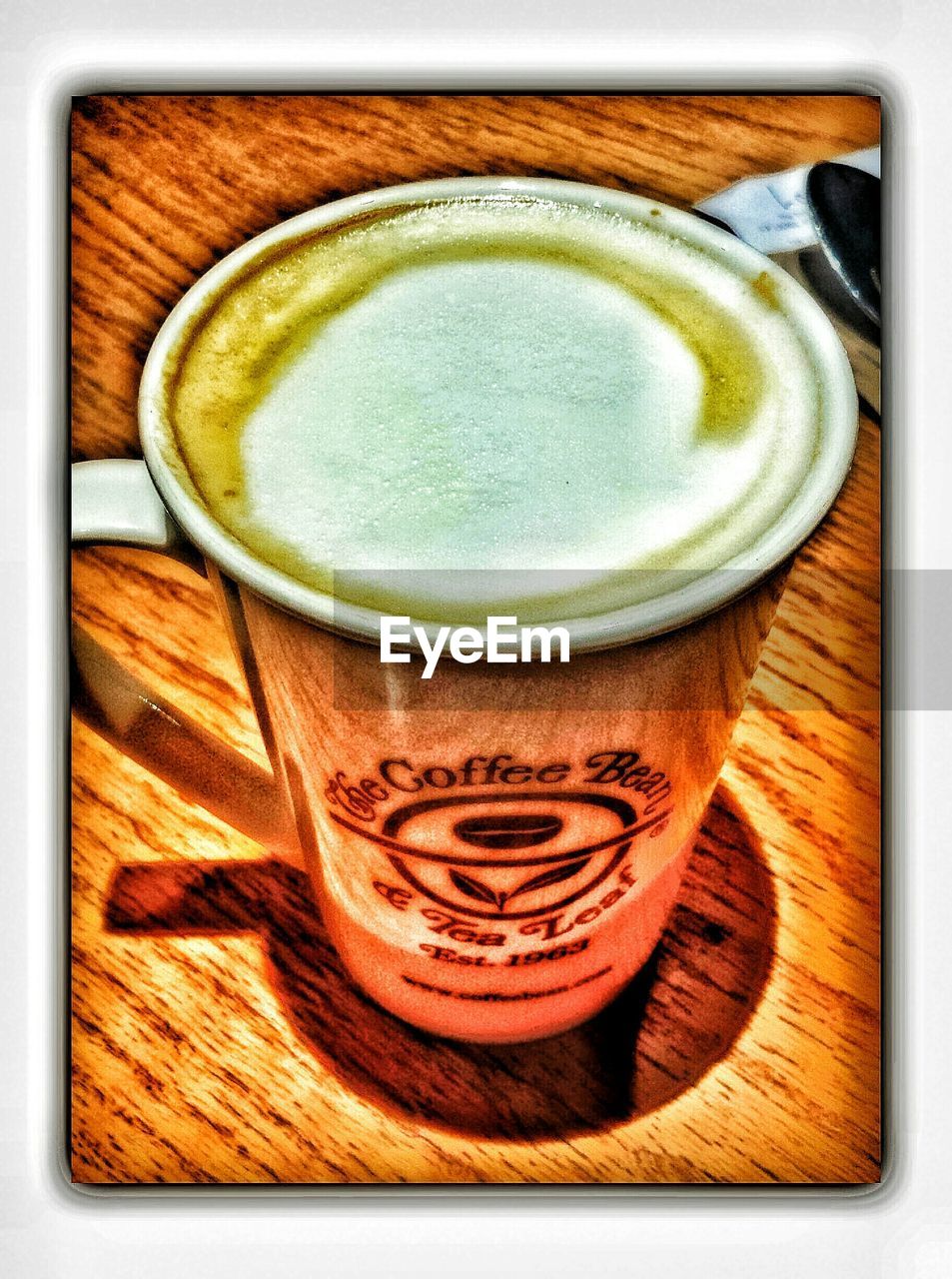 CLOSE-UP OF COFFEE CUP ON TABLE