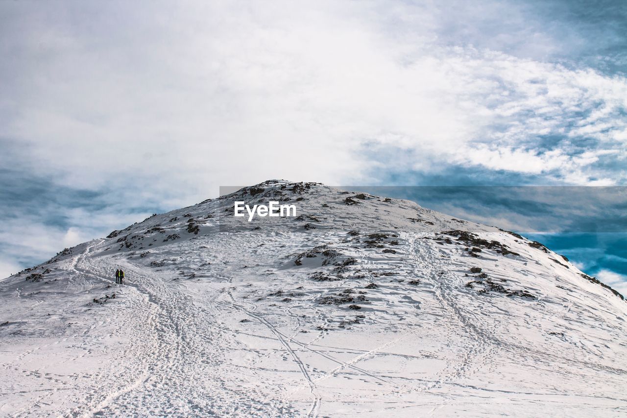 Snow covered mountain against sky