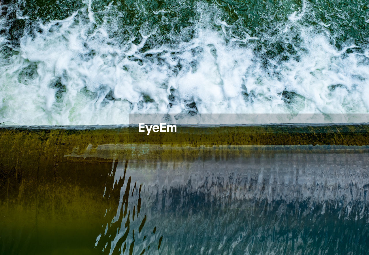 Water flowing over the dam, top view