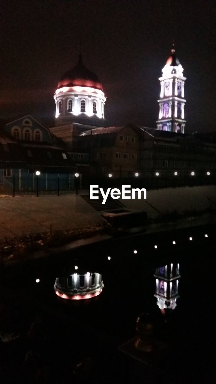 LOW ANGLE VIEW OF ILLUMINATED CHURCH