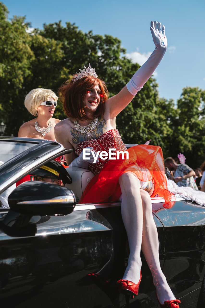 WOMAN SITTING IN A CAR