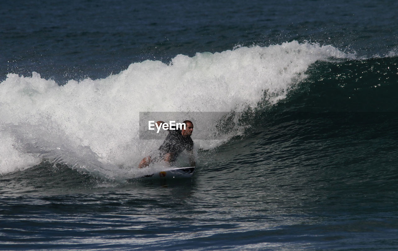 Man surfing in sea